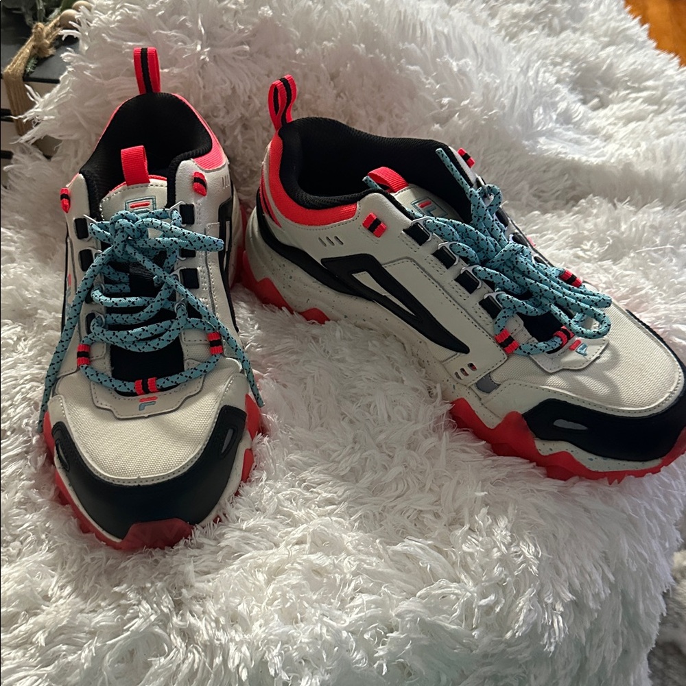 Stylish Sneakers with Red Soles and Blue Laces